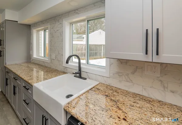 a kitchen with a stove and a sink