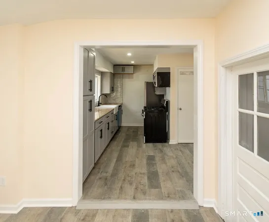 a view of a kitchen cabinets and an empty room