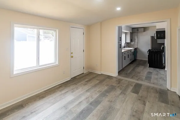 a view of a room with window and cabinet