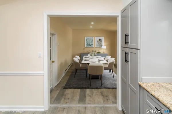 a view of a dining area with a table and chairs