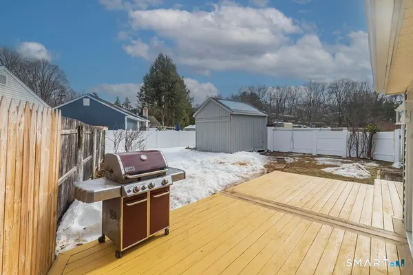 a view of a backyard with sitting area