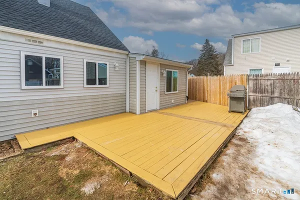 a view of backyard with a swimming pool