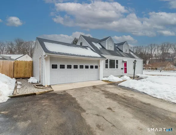 a front view of a house with a garage