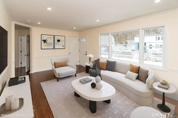 a living room with furniture and a large window