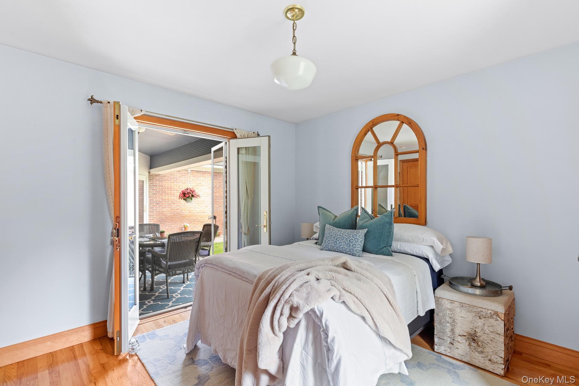 2 Sunset Road Sag Harbor, NY 11963 - Photo 13 of 21 Bedroom featuring wood finished floors and access to exterior