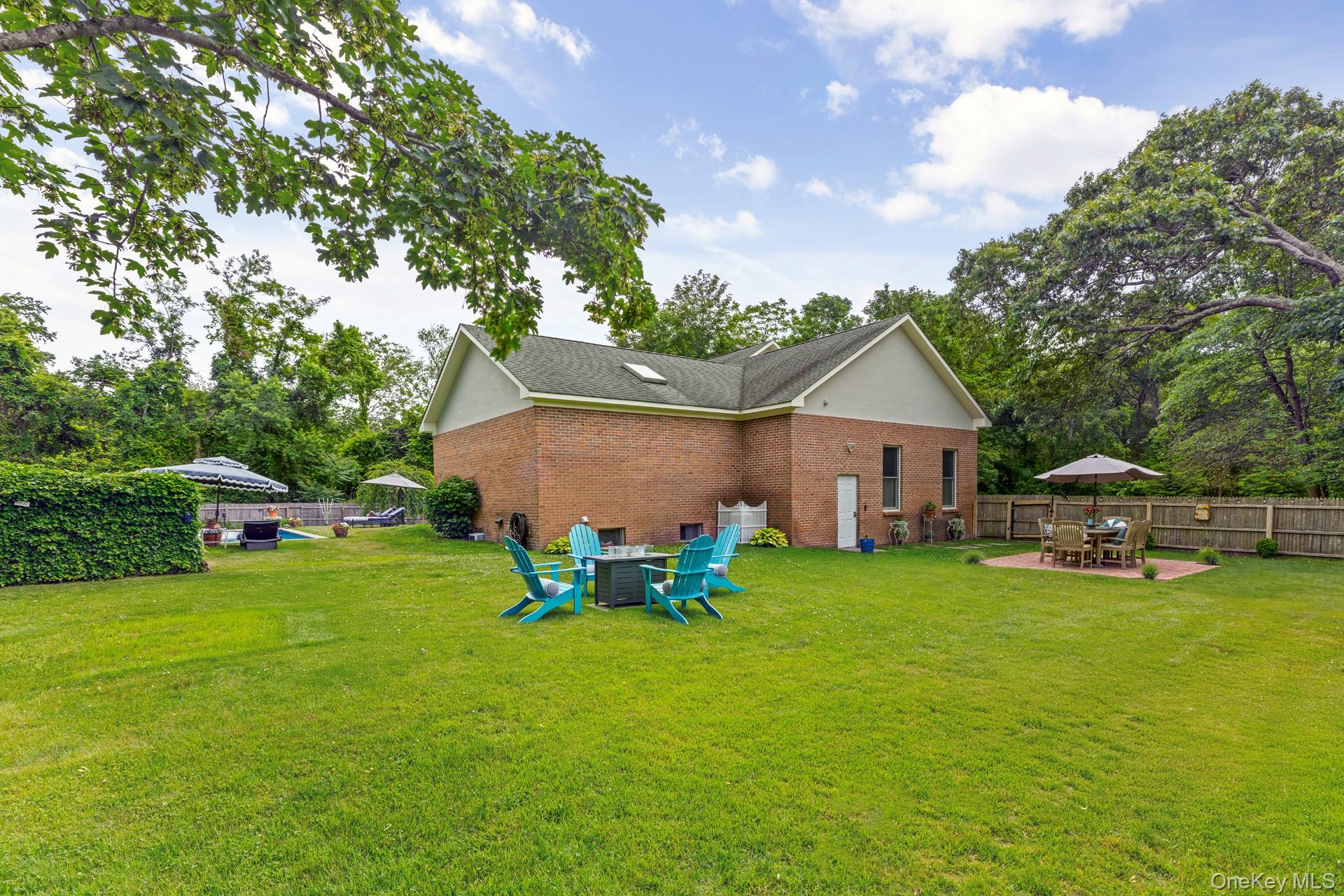 2 Sunset Road Sag Harbor, NY 11963 - Photo 14 of 21 a view of a house with a yard porch and sitting area