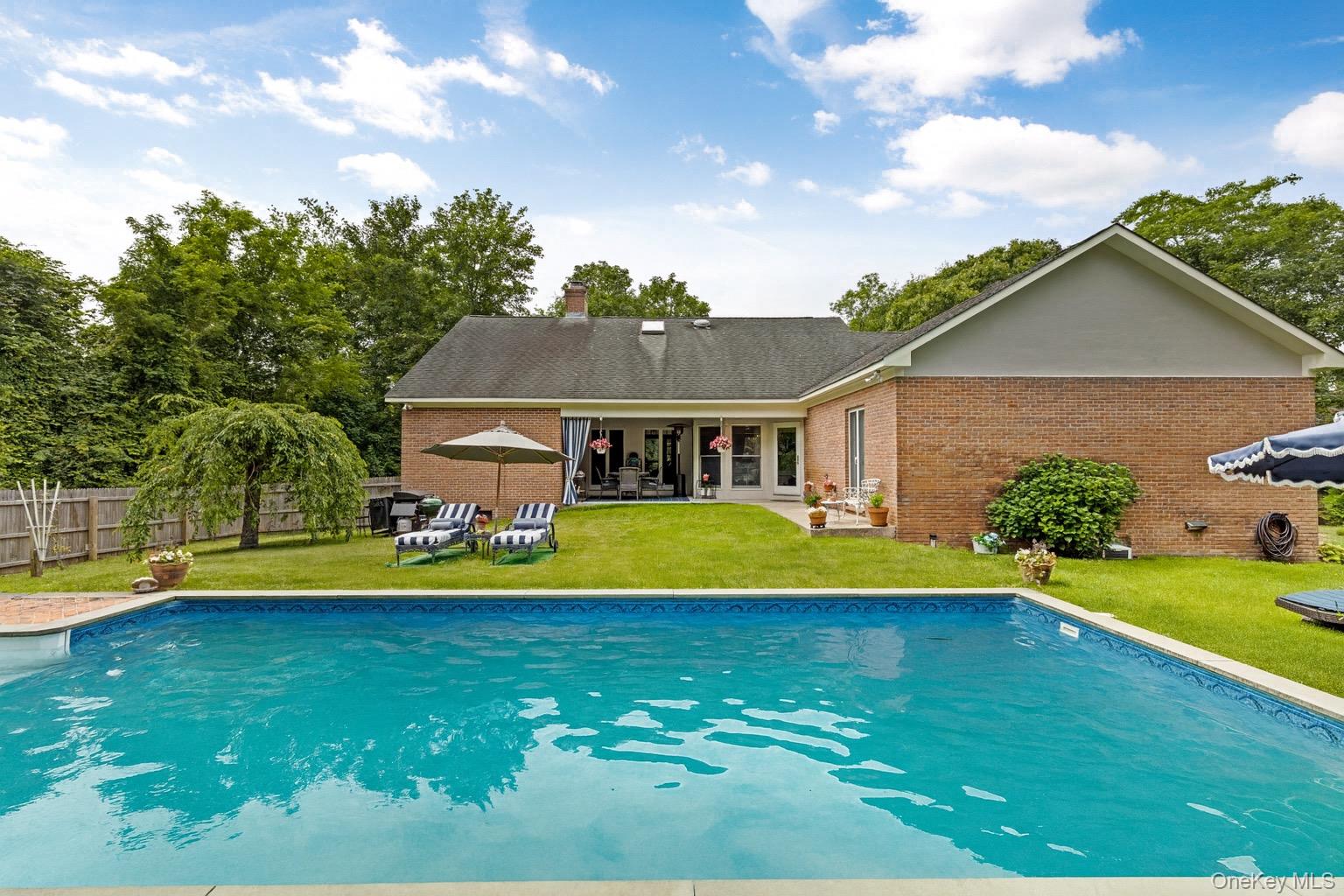 2 Sunset Road Sag Harbor, NY 11963 - Photo 2 of 21 a view of a house with a swimming pool