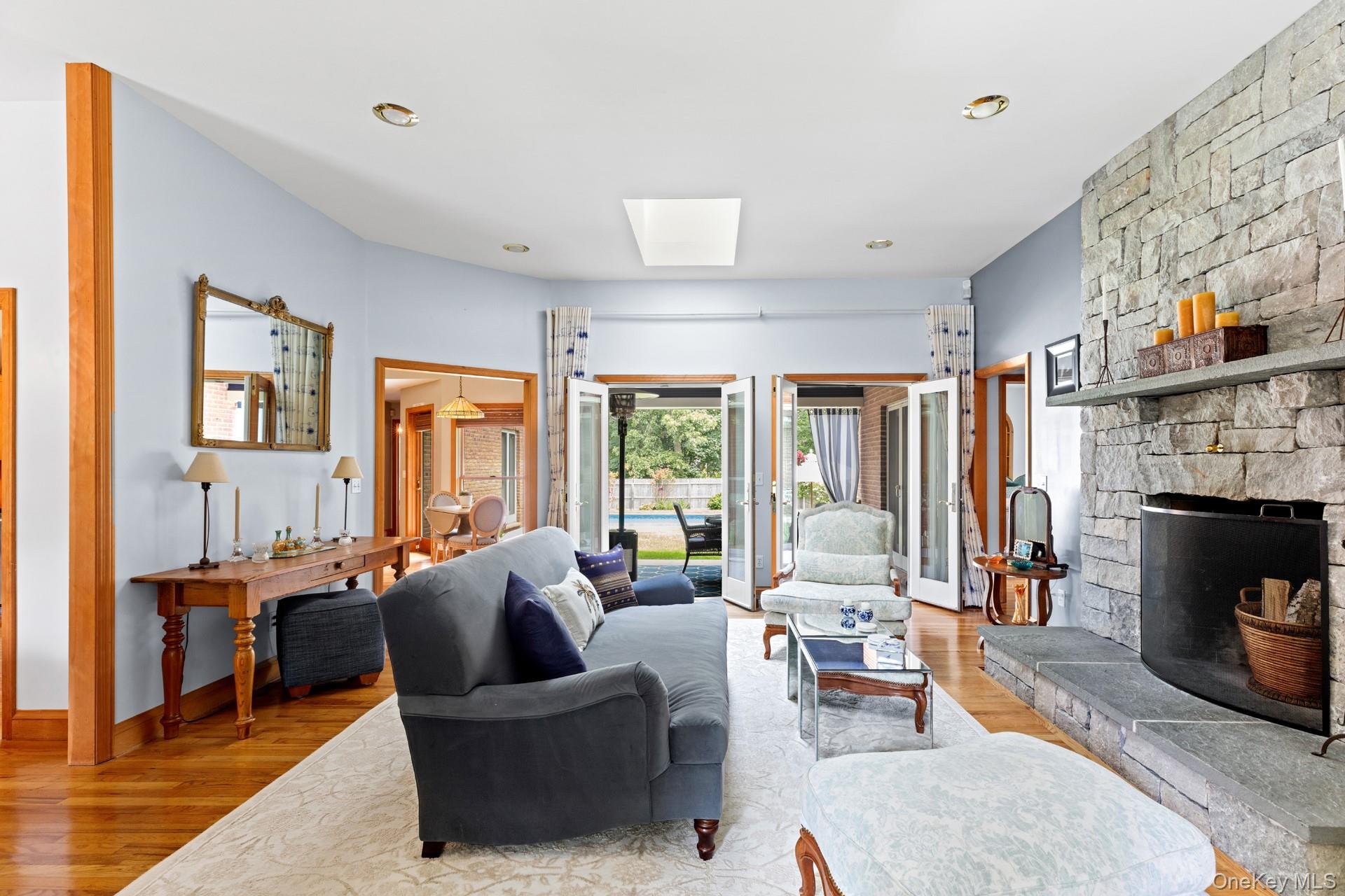 2 Sunset Road Sag Harbor, NY 11963 - Photo 8 of 21 Living area with wood finished floors, a fireplace, and recessed lighting