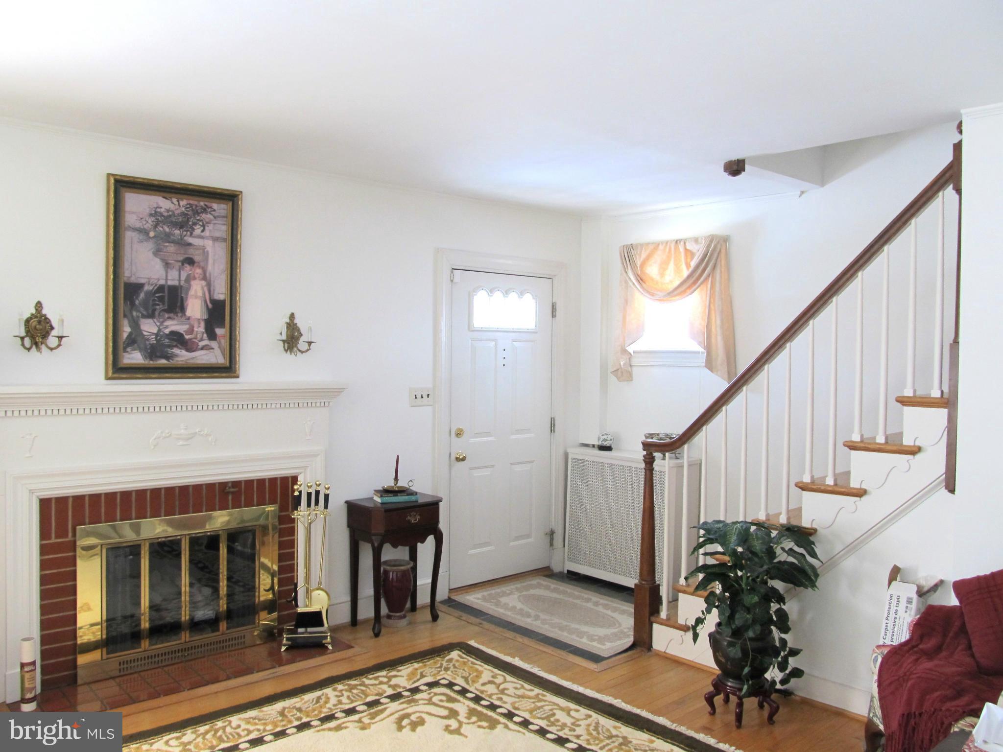 422 Forest View Road Linthicum, MD 21090 - Photo 2 of 25 a living room with furniture and a fireplace