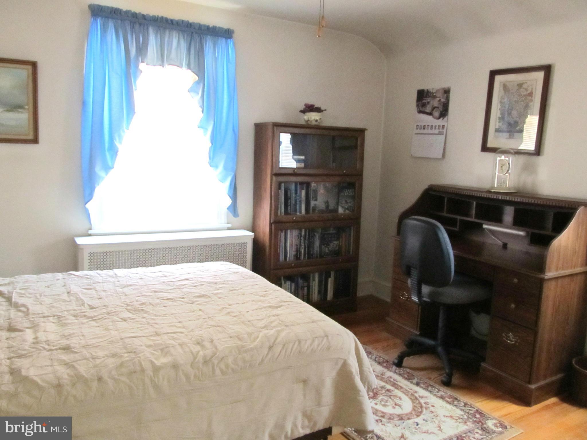 422 Forest View Road Linthicum, MD 21090 - Photo 12 of 25 a bedroom with a bed and a window