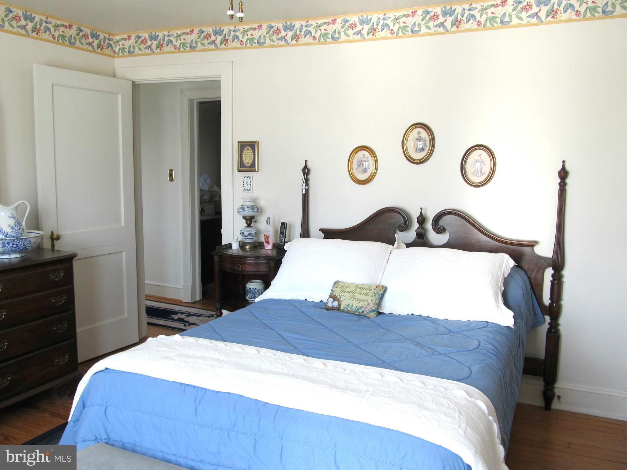 422 Forest View Road Linthicum, MD 21090 - Photo 14 of 25 a bedroom with a bed and a dresser