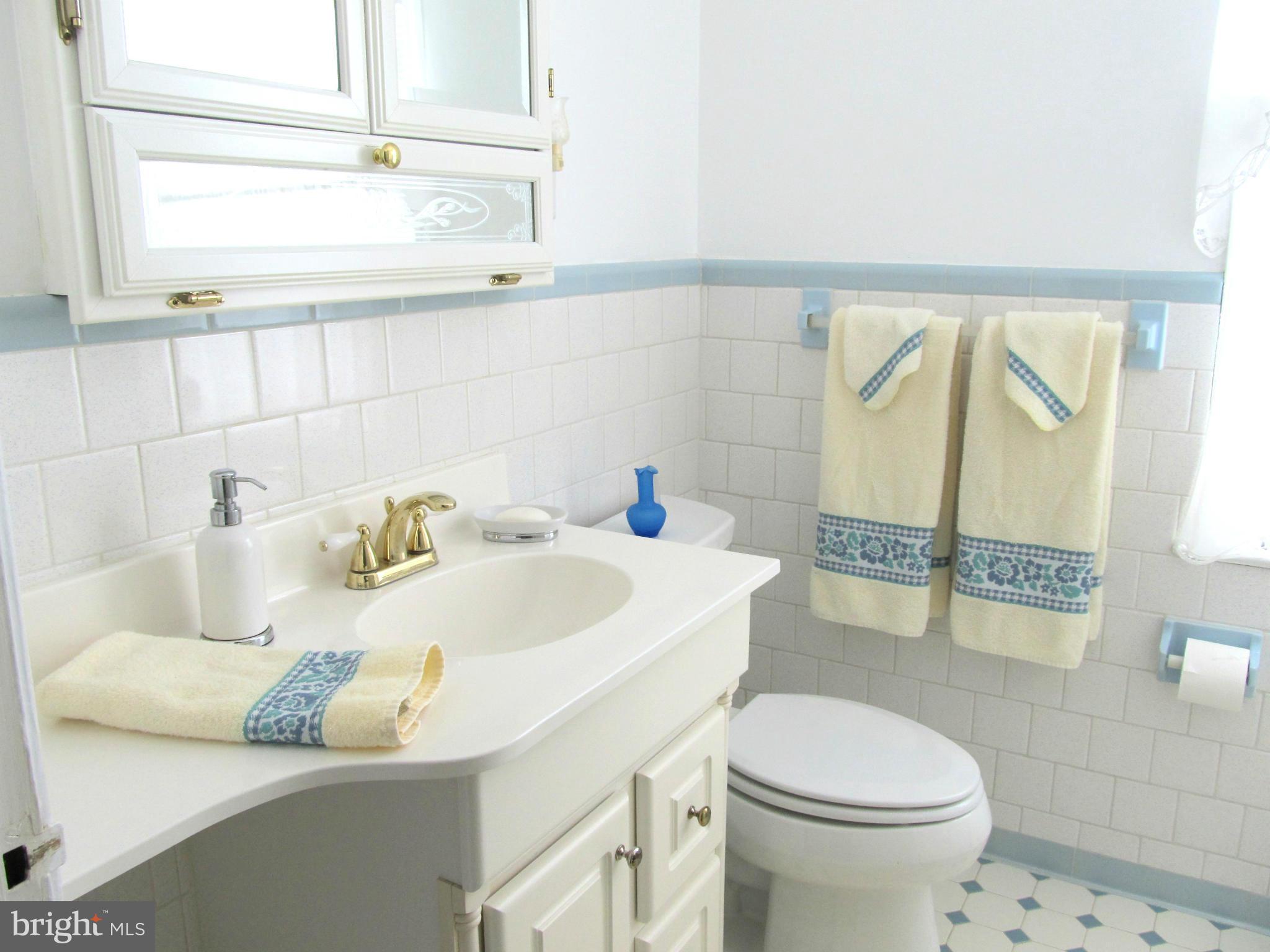 422 Forest View Road Linthicum, MD 21090 - Photo 15 of 25 a bathroom with a sink toilet and shower