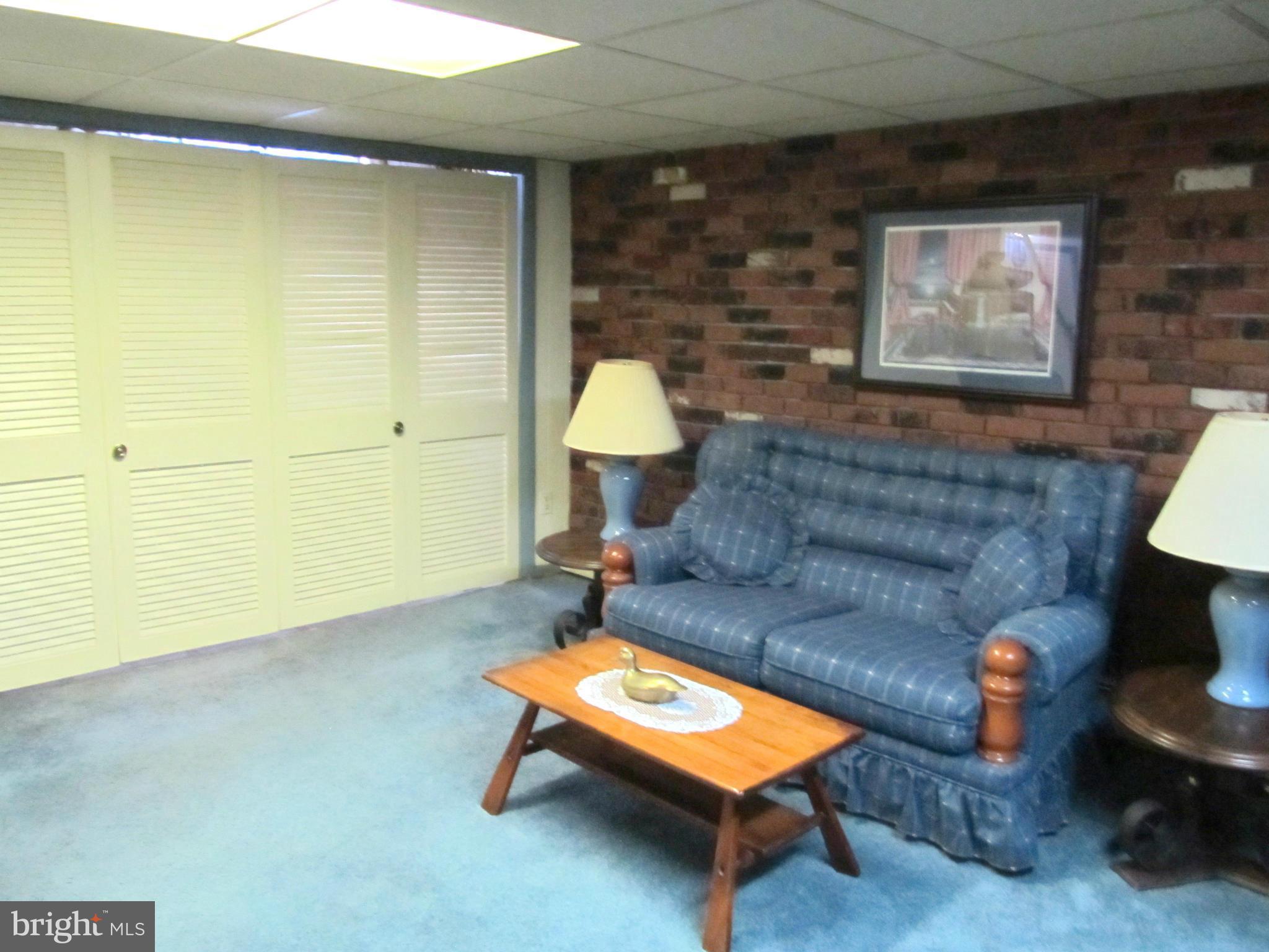 422 Forest View Road Linthicum, MD 21090 - Photo 21 of 25 a living room with furniture and a window