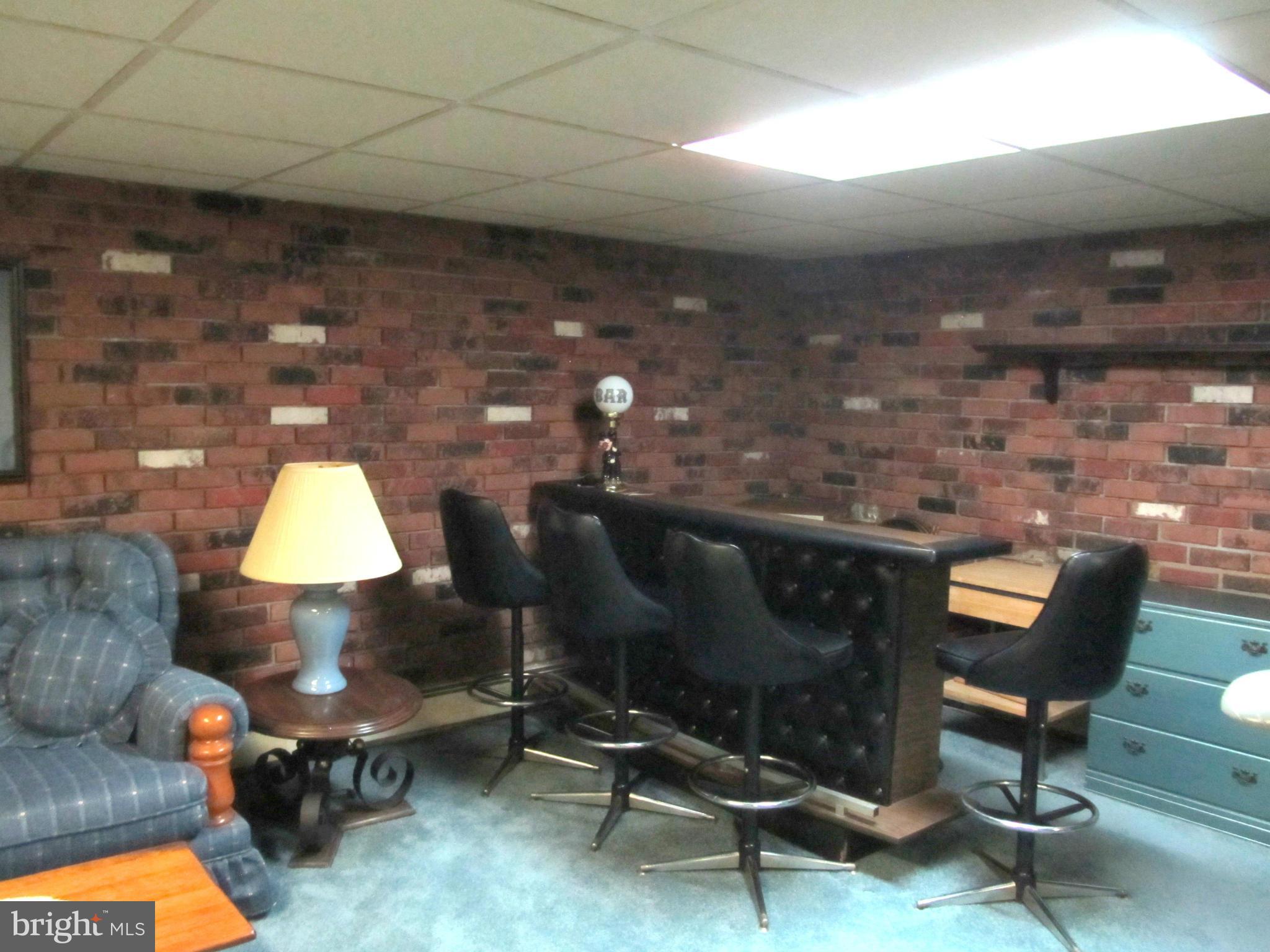 422 Forest View Road Linthicum, MD 21090 - Photo 22 of 25 a living room with furniture and a fireplace