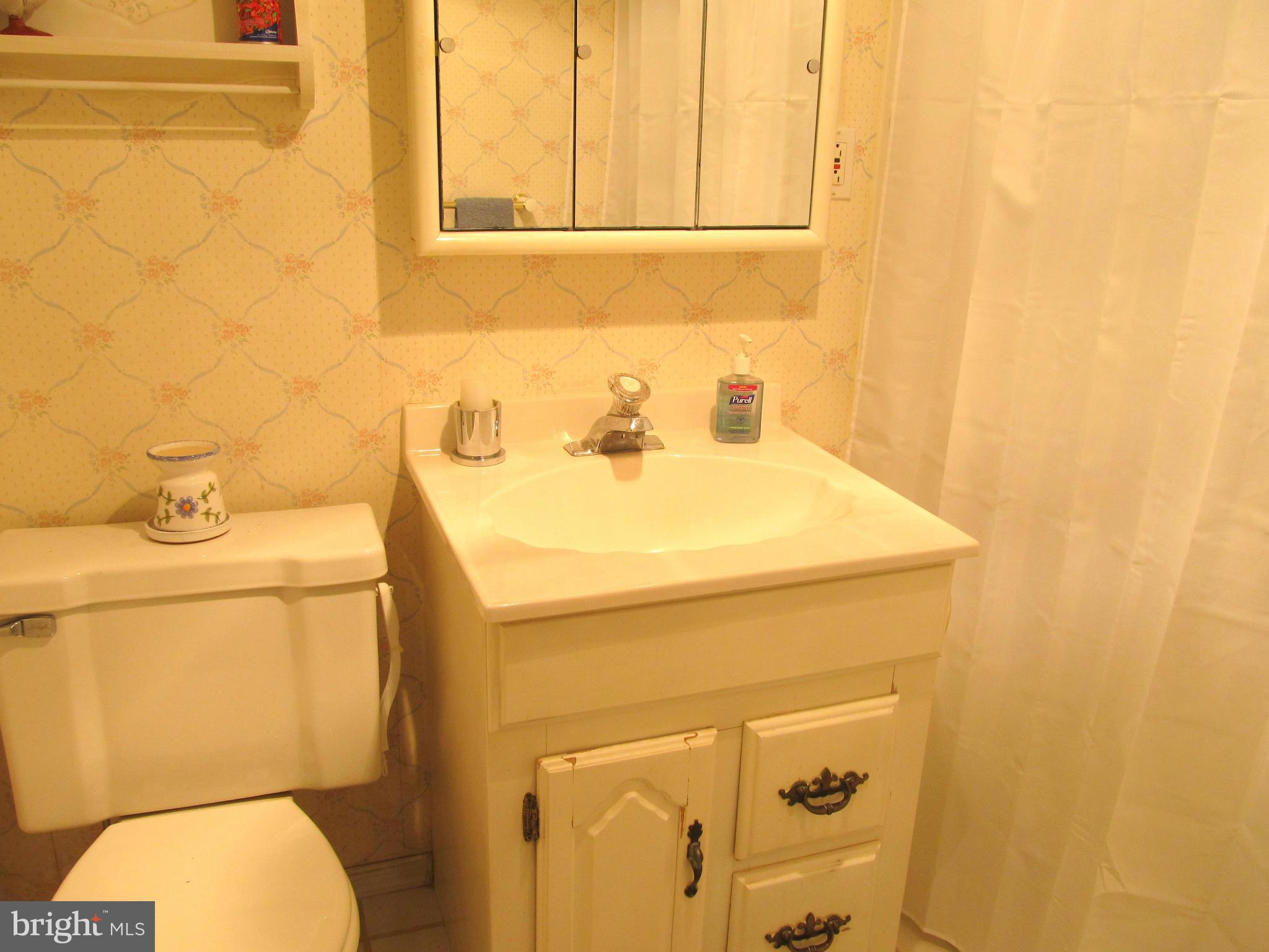 422 Forest View Road Linthicum, MD 21090 - Photo 23 of 25 a bathroom with a sink and a toilet