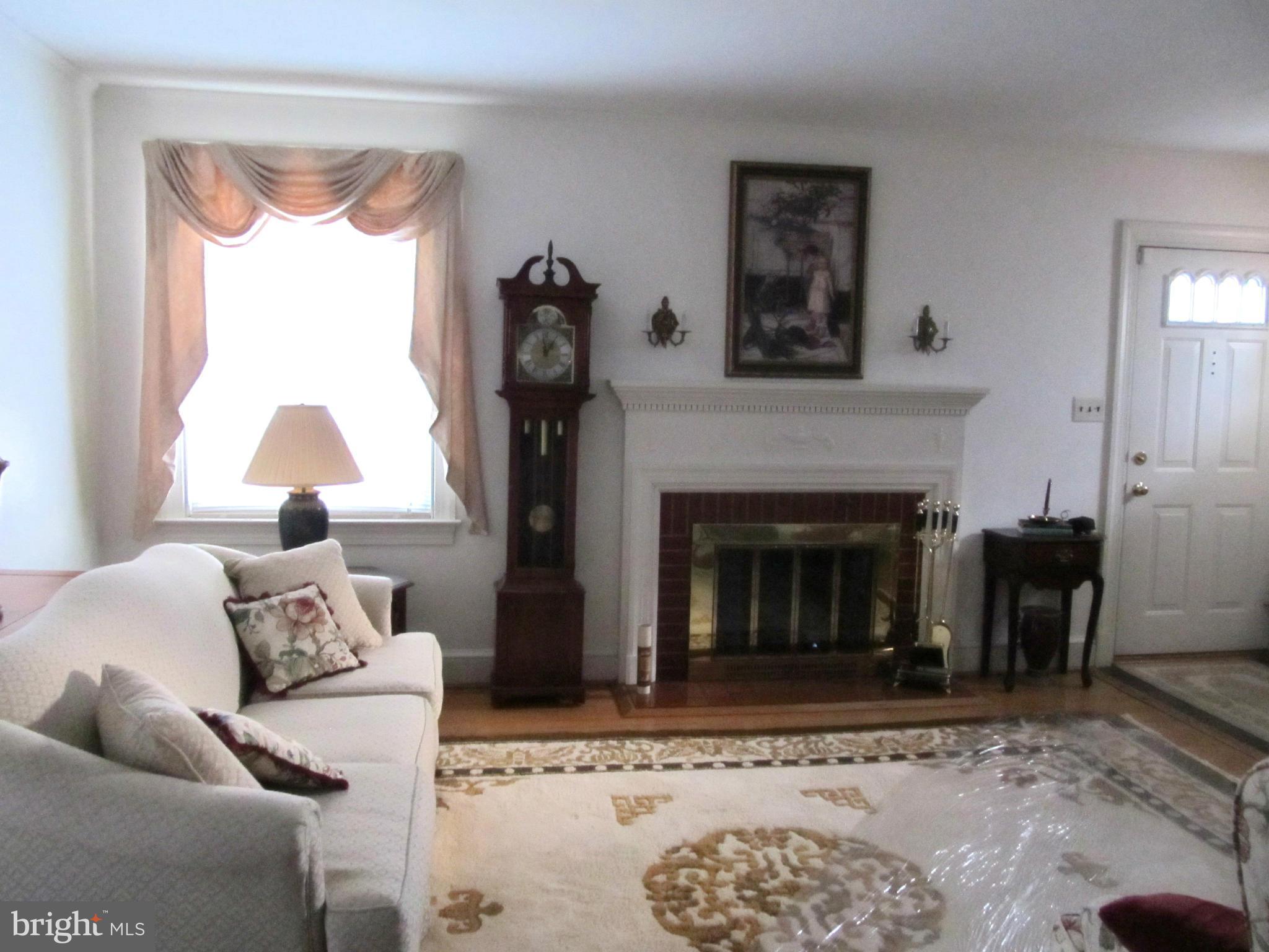 422 Forest View Road Linthicum, MD 21090 - Photo 4 of 25 a living room with furniture and a fireplace
