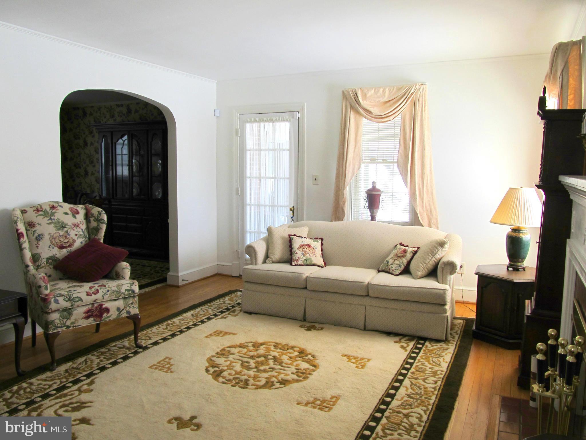 422 Forest View Road Linthicum, MD 21090 - Photo 5 of 25 a living room with furniture and a fireplace