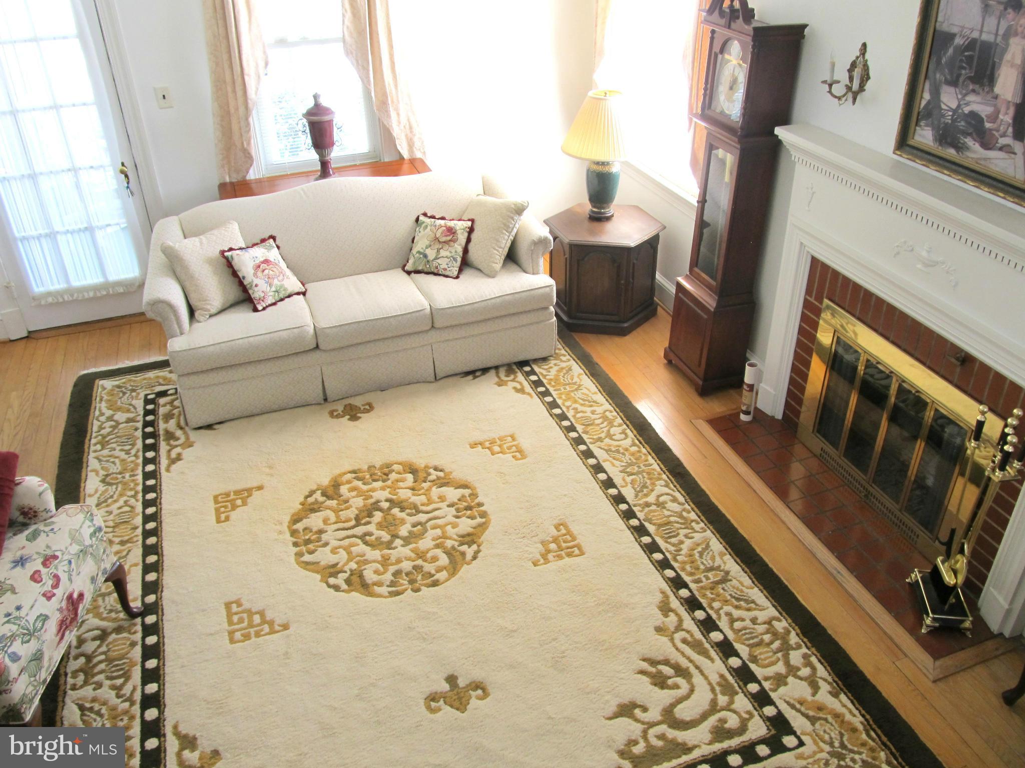 422 Forest View Road Linthicum, MD 21090 - Photo 6 of 25 a living room with furniture and a fireplace