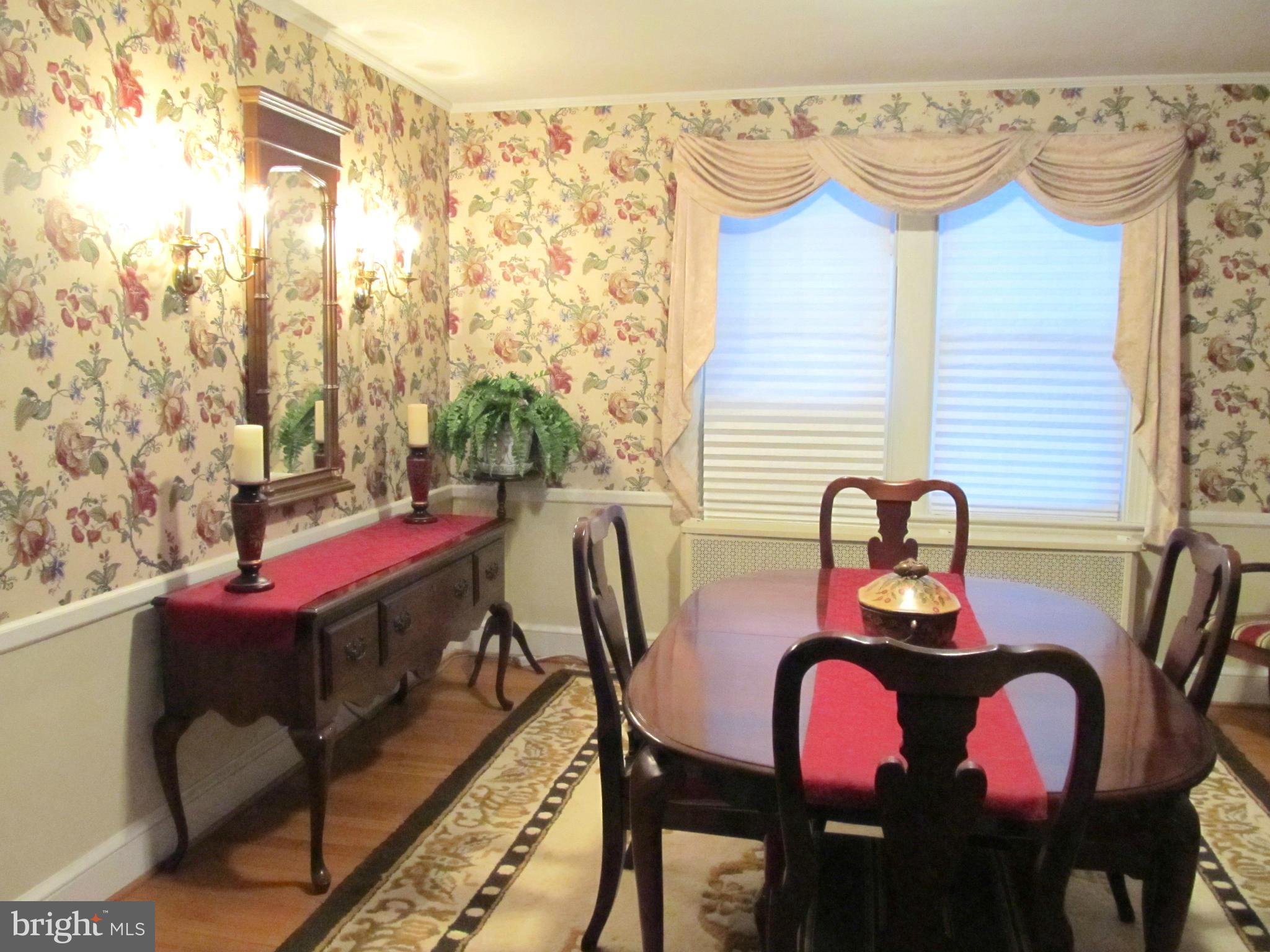 422 Forest View Road Linthicum, MD 21090 - Photo 8 of 25 a dining room with furniture and wooden floor