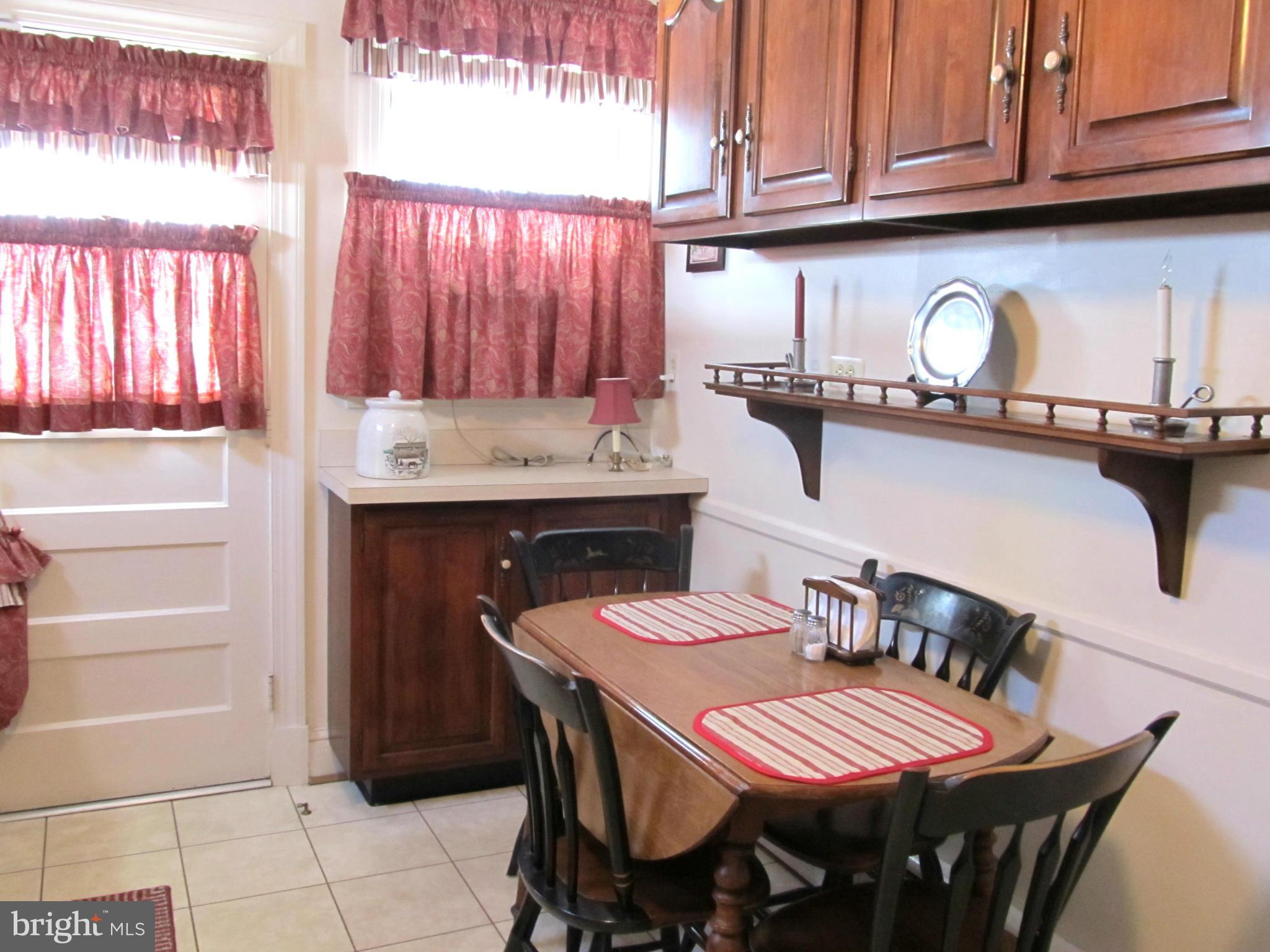 422 Forest View Road Linthicum, MD 21090 - Photo 10 of 25 a view of a dining area with furniture and window