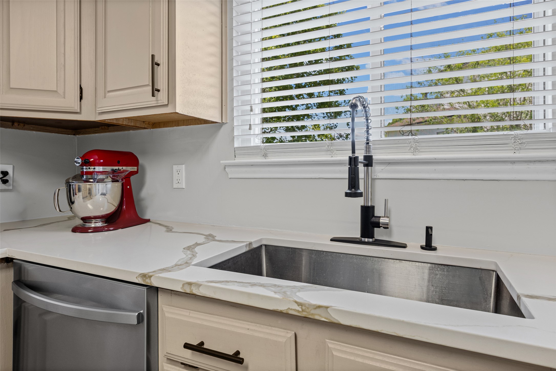3011 Wadsworth Way Austin, TX 78748 - Photo 23 of 35 Modern kitchen with sleek counters and a deep sink for easy meal preparation.