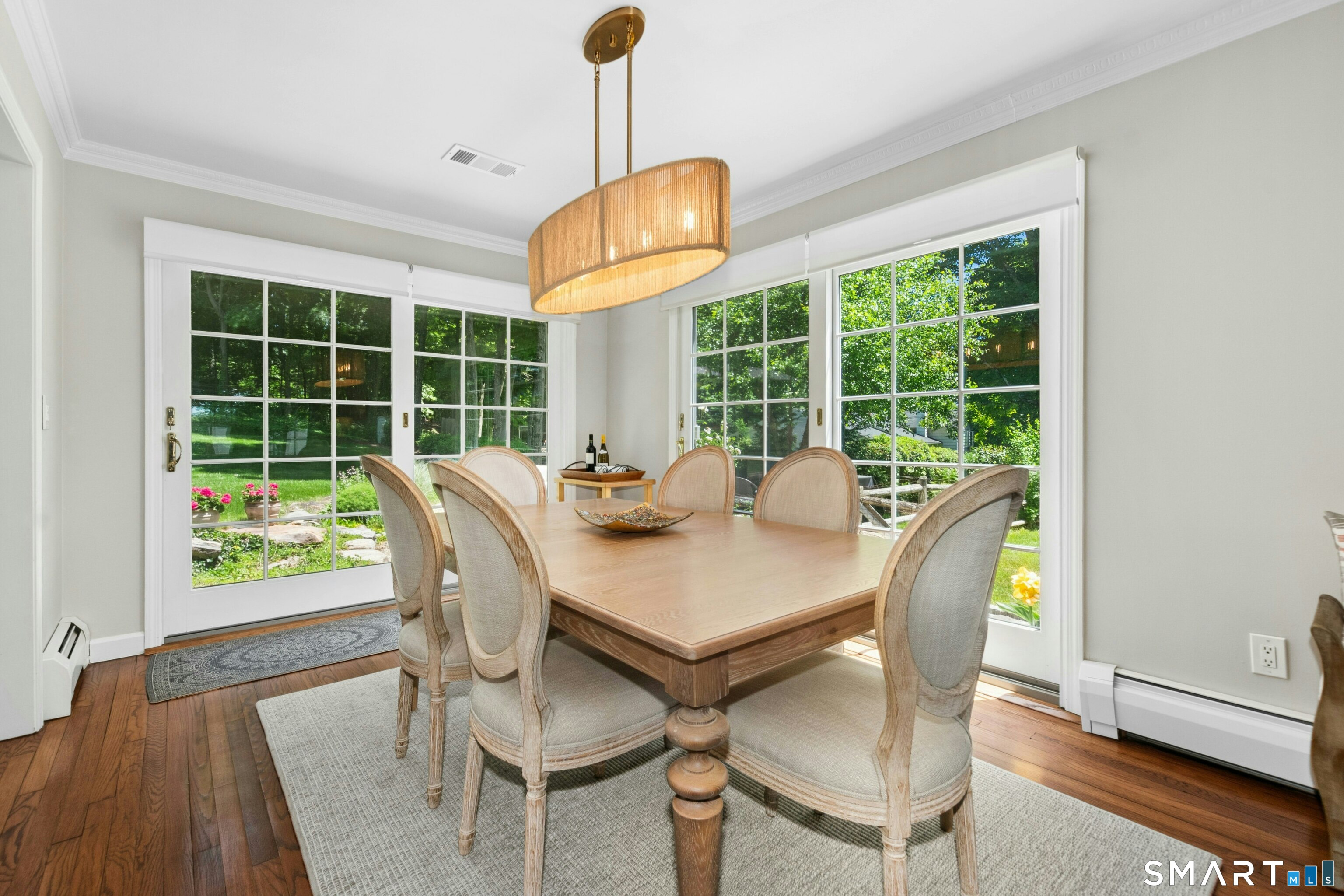 29 Old Farm Road Weston, CT 06883 - Photo 9 of 27 The dining room has access to a stone patio with masonry walls and a garden with four raised beds.