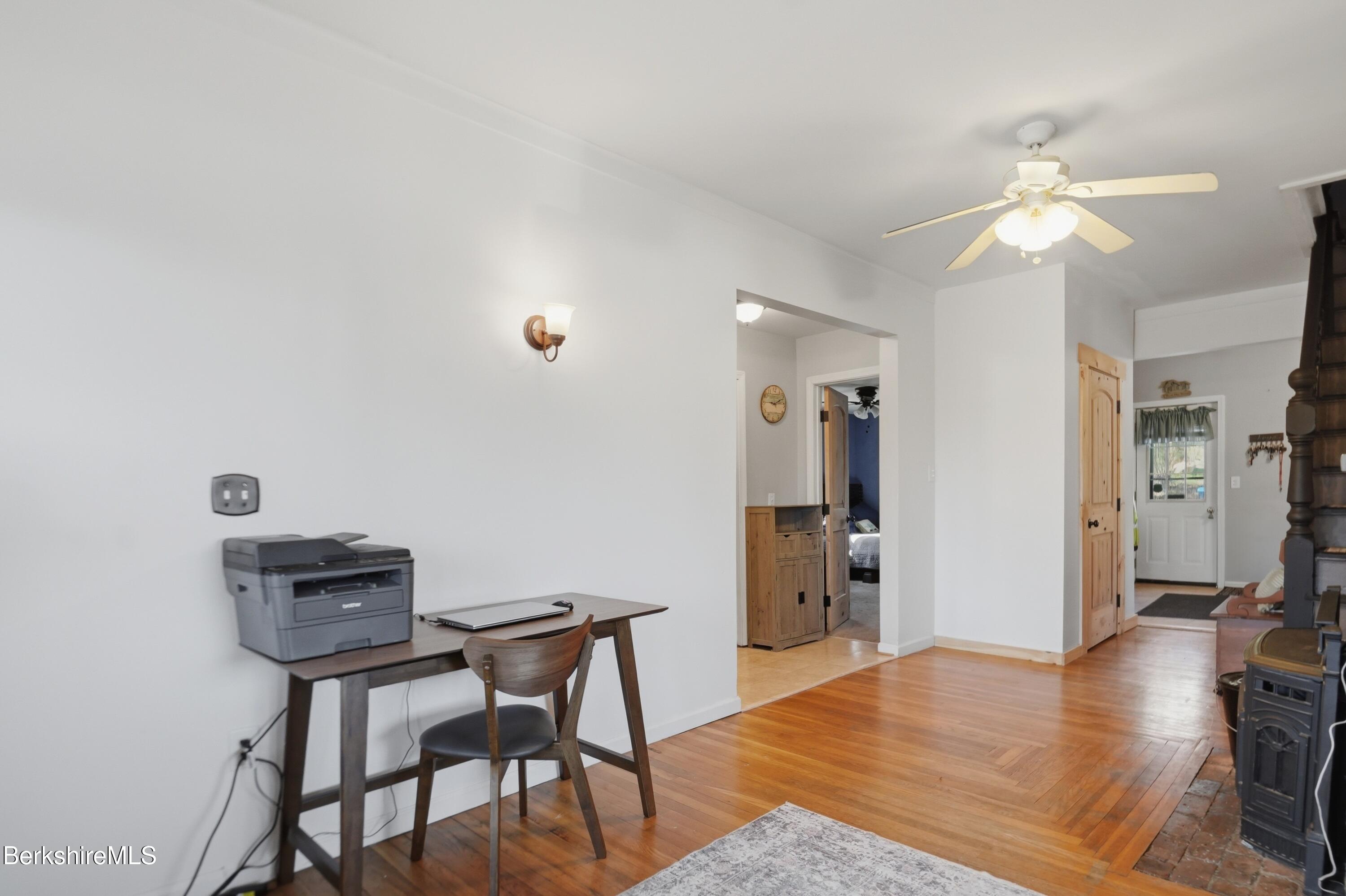 22 Broadway Street Pittsfield, MA 01201 - Photo 32 of 84 a view of a workspace with furniture and wooden floor