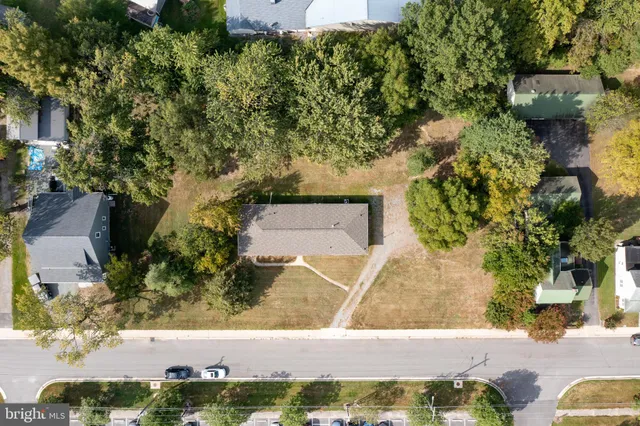 an aerial view of a house with outdoor space