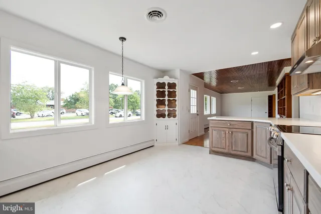 a kitchen with sink cabinets and window