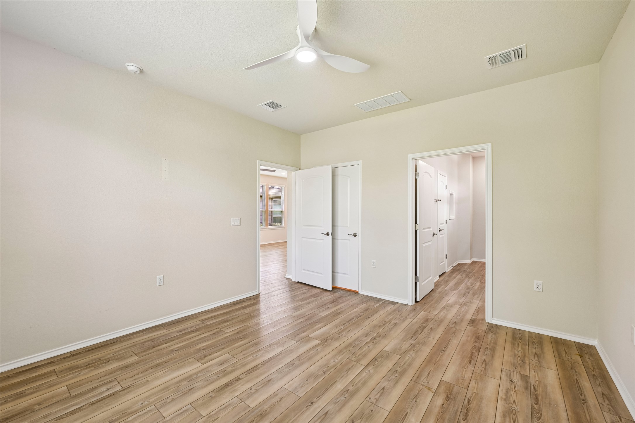 401 Yorktown Street Georgetown, TX 78633 - Photo 20 of 38 Spacious room with wood-finish flooring, light-toned walls, and a modern ceiling fan with integrated lighting
