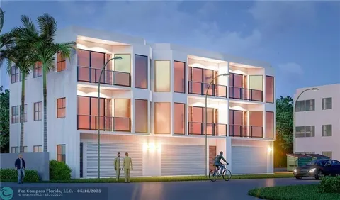 a front view of residential houses with yard