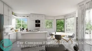 a living room with a large window and a table