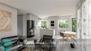 a living room with fireplace furniture and a floor to ceiling window