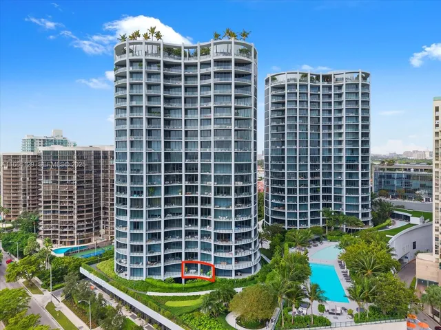 a front view of a building with a yard