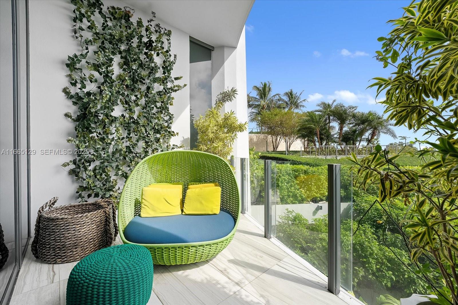 2811 South Bayshore Drive, Unit 4C Miami, FL 33133 - Photo 17 of 37 a room with furniture and a potted plant