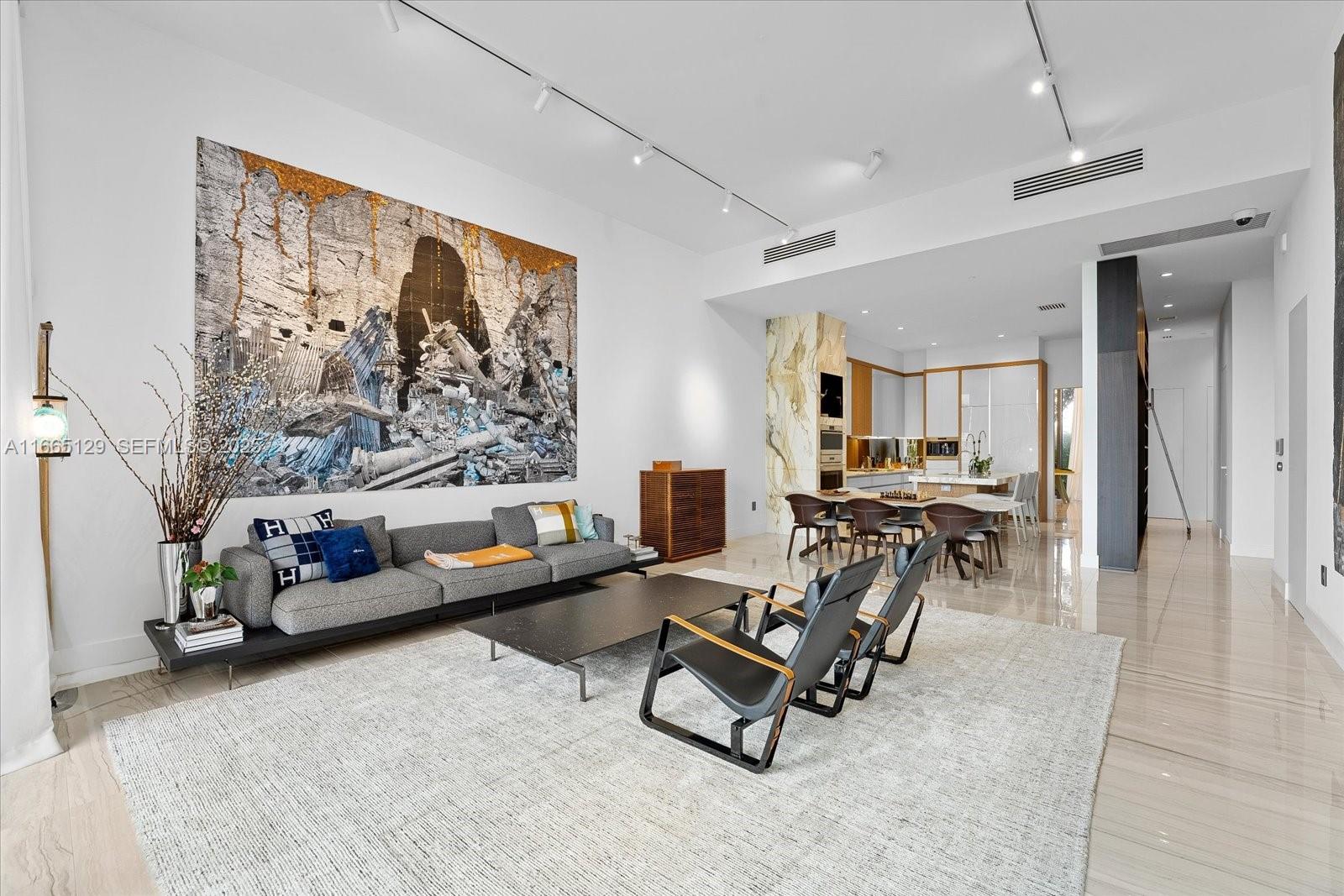 2811 South Bayshore Drive, Unit 4C Miami, FL 33133 - Photo 4 of 37 a living room with furniture and a large window