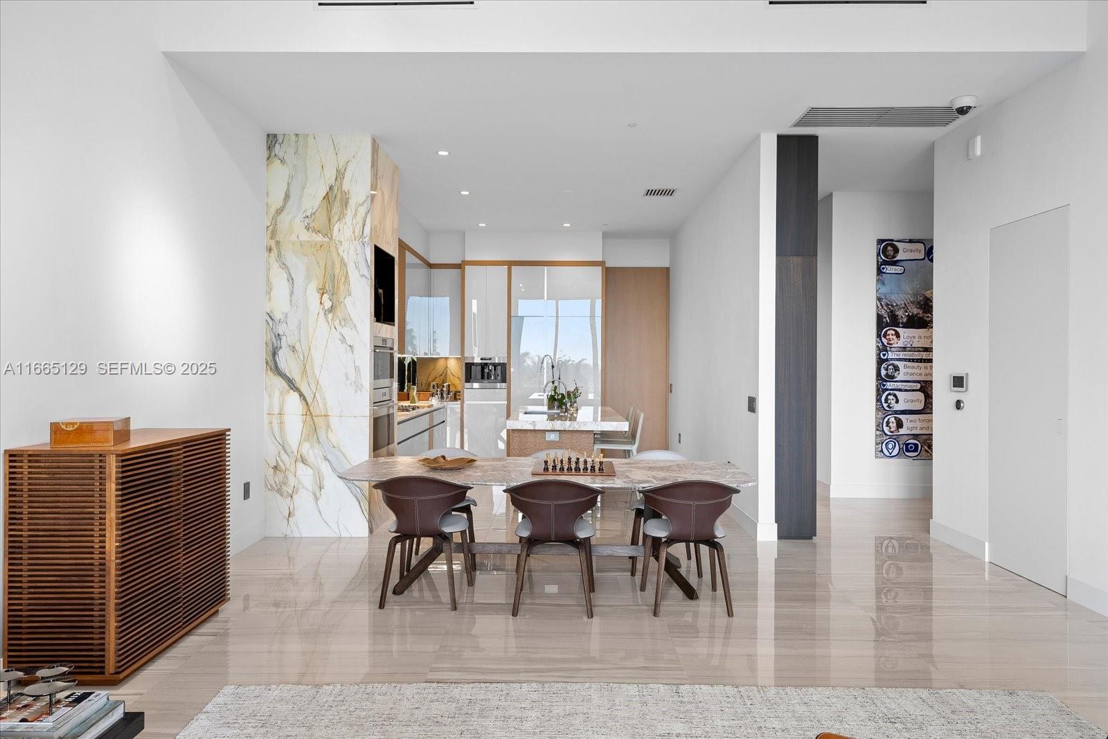 2811 South Bayshore Drive, Unit 4C Miami, FL 33133 - Photo 6 of 37 a view of a dining room with furniture
