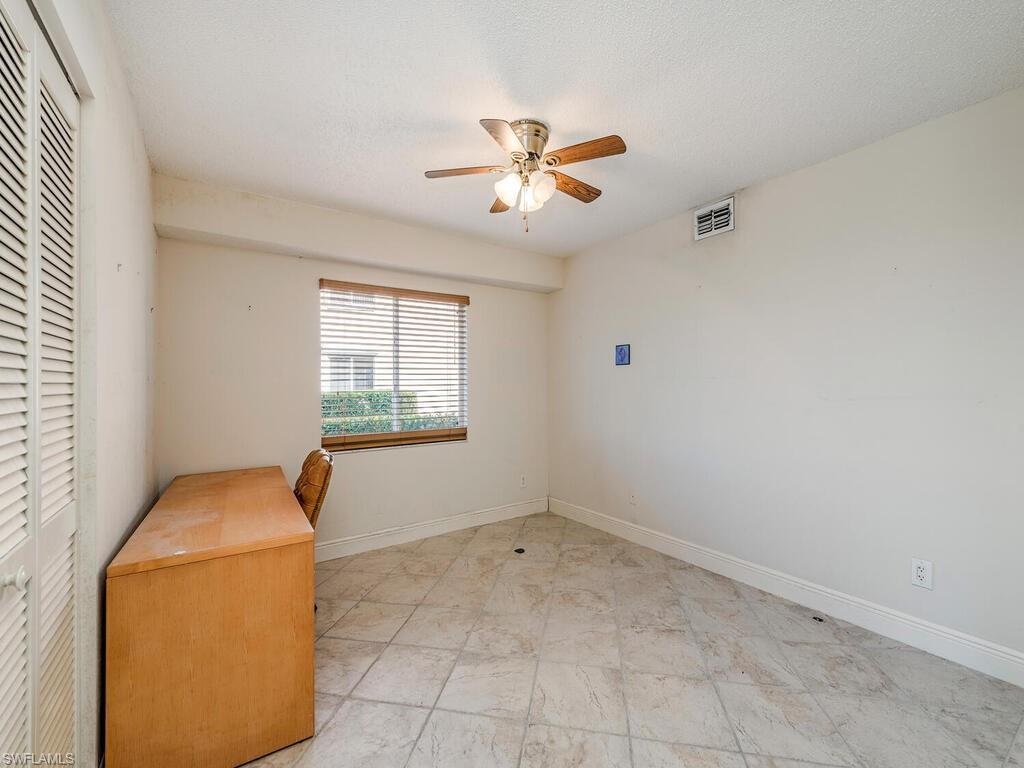 5920 Cranbrook Way, Unit F106 Naples, FL 34112 - Photo 11 of 12 a view of livingroom with window