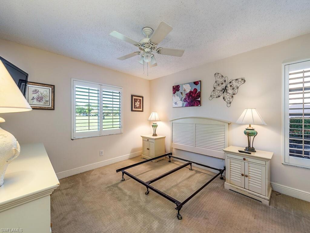 5920 Cranbrook Way, Unit F106 Naples, FL 34112 - Photo 7 of 12 a living room with furniture and a window