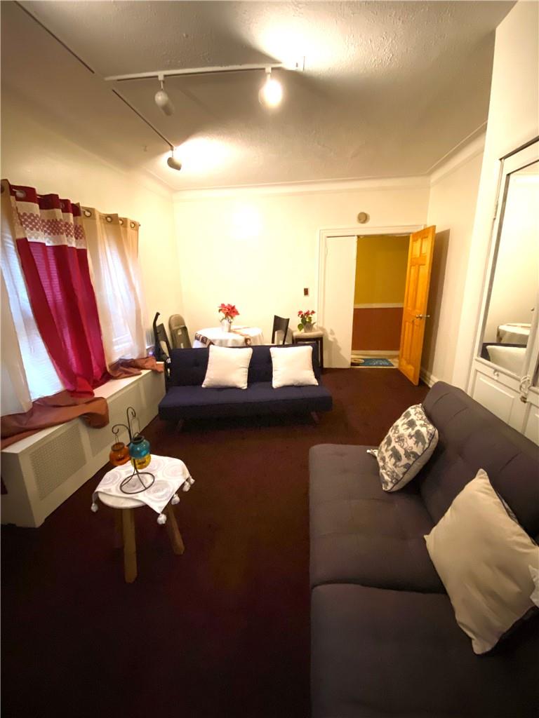 4058 Bronx Boulevard Bronx, NY 10466 - Photo 13 of 19 a living room with furniture and a large window