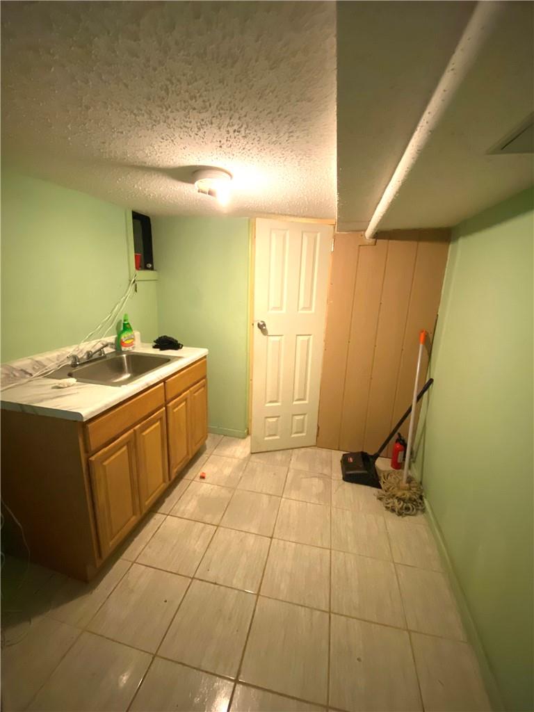 4058 Bronx Boulevard Bronx, NY 10466 - Photo 15 of 19 a utility room with a sink and cabinets