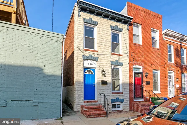 a front view of a building with many windows