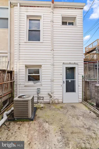 a view of house with backyard space