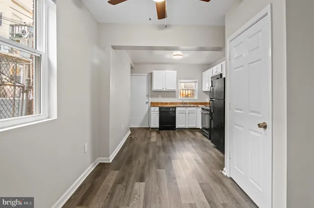 a kitchen with stainless steel appliances granite countertop a stove and a refrigerator
