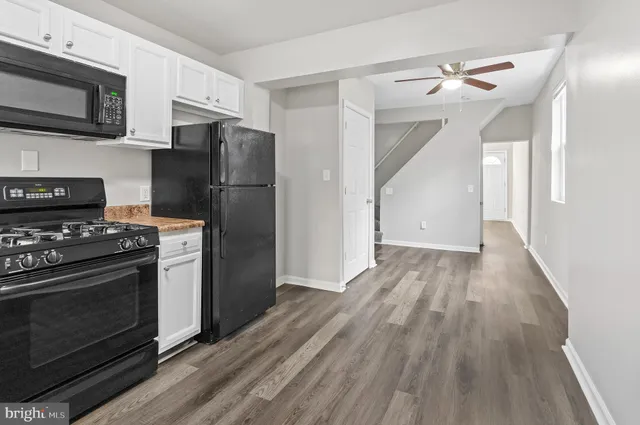 a kitchen with a stove microwave and refrigerator
