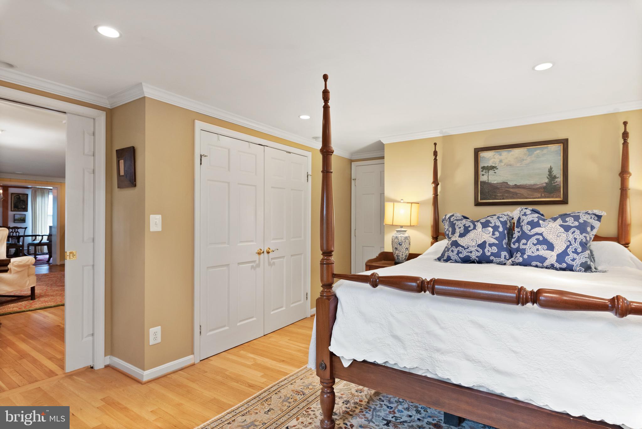 1858 Burley Road Annapolis, MD 21409 - Photo 45 of 76 a spacious bedroom with a bed and a painting on the wall