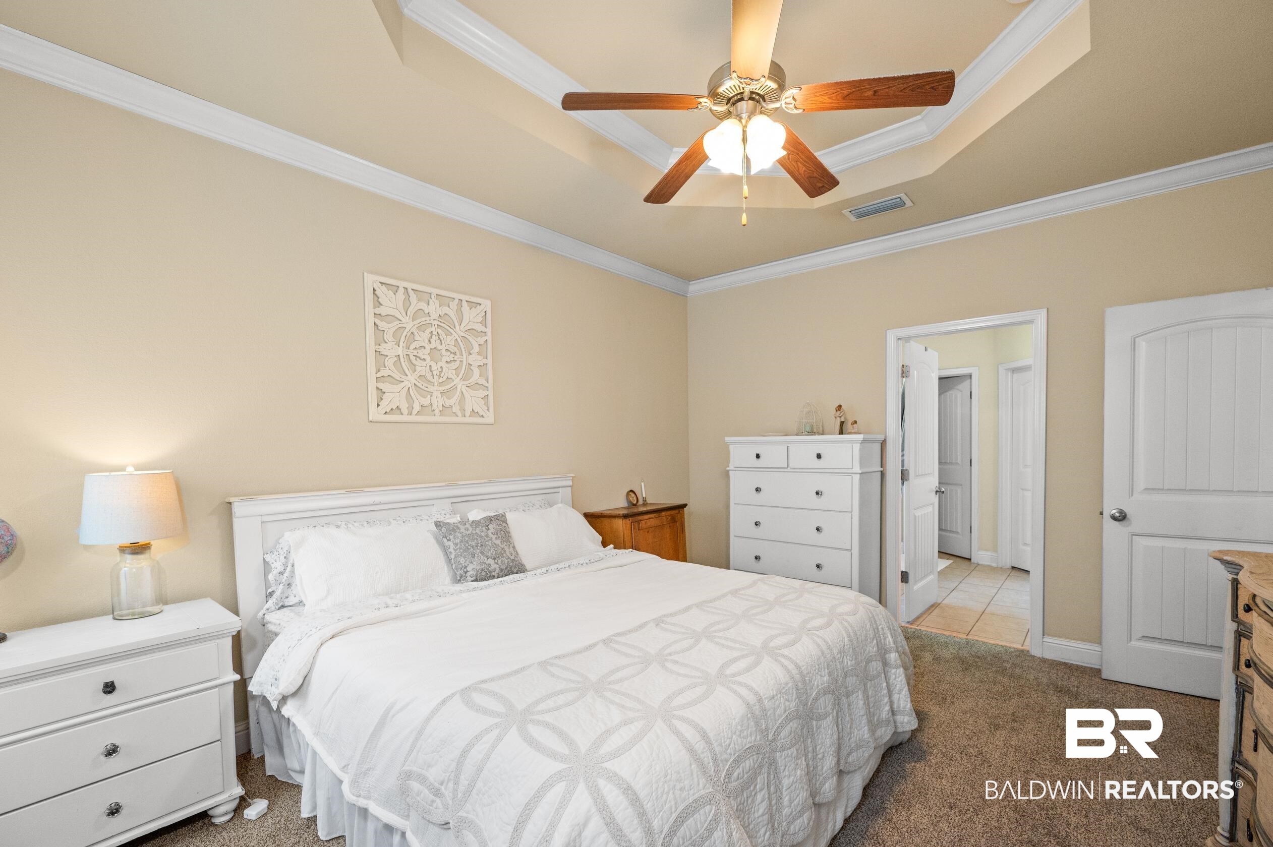 745 Bonaventure Street Fairhope, AL 36532 - Photo 14 of 36 Carpeted bedroom with a tray ceiling, crown molding, and ceiling fan