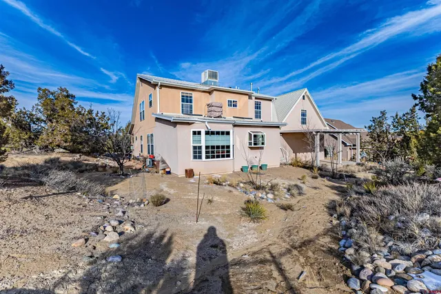 a view of a house with a snow in the yard