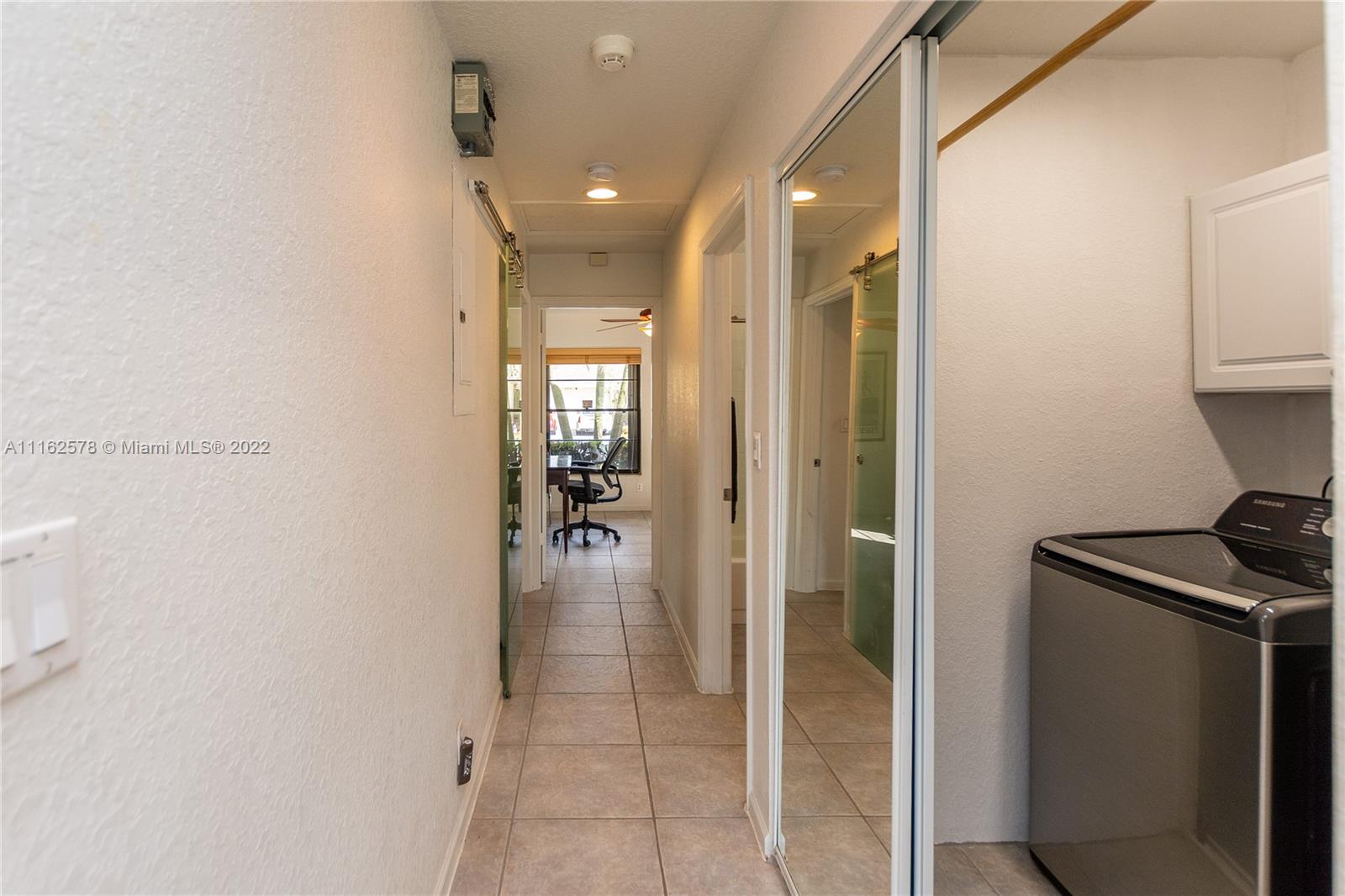 11612 Quiet Waters Lane Boca Raton, FL 33428 - Photo 24 of 70 a bathroom with a shower and a sink