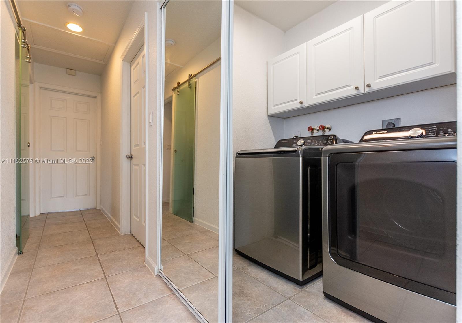 11612 Quiet Waters Lane Boca Raton, FL 33428 - Photo 25 of 70 a kitchen with stainless steel appliances granite countertop a refrigerator and a stove
